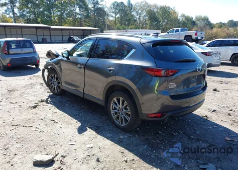 2021 Mazda Cx-5 Signature z USA, uszkodzony, nr VIN JM3KFBEY6M0449522